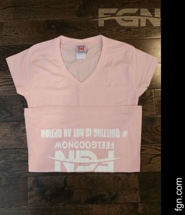 A pink shirt with white lettering on it.