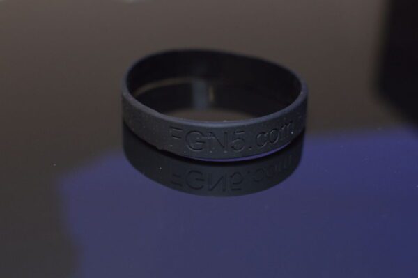 A black rubber band with the word " love ".
